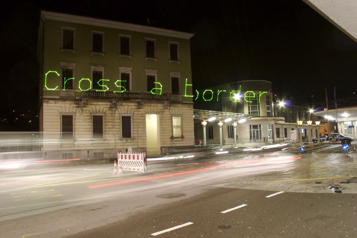 Migration Manifesto, laser projection at Swiss-Italian border, Chiasso/Como, 2006